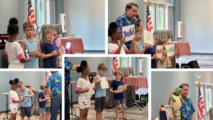 A man gives a presentation using a puppet to children.