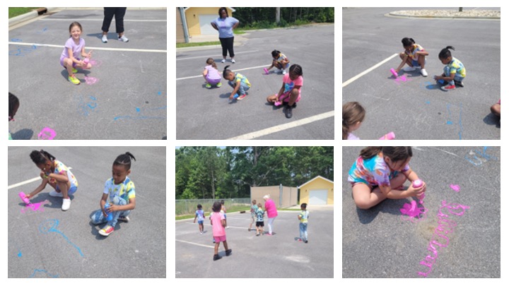 Children painting with chalk.