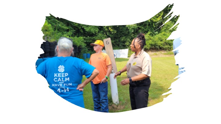 4-H'ers learn from a firearms instructor.