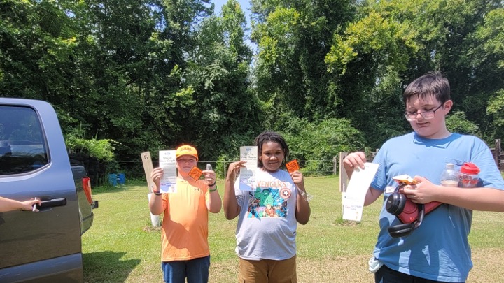 Kids show off their gift certificates