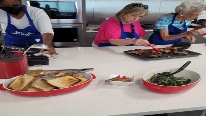 Women prepare dishes