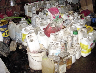 White containers that contain pesticide. 