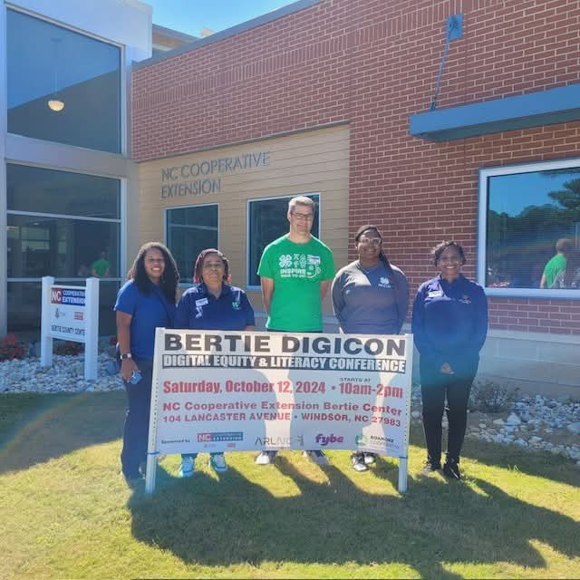 People standing in front of 2024 Bertie DigiCon sign